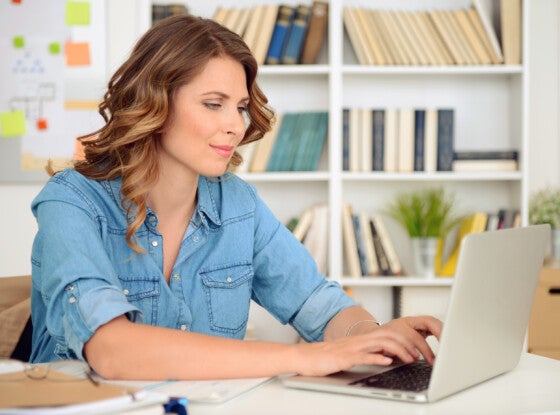 blonde woman working in the office