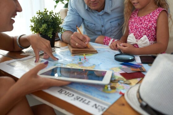 Family discussing places where to to for vacation