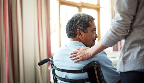 Shot of a young nurse caring for a senior man in a retirement home