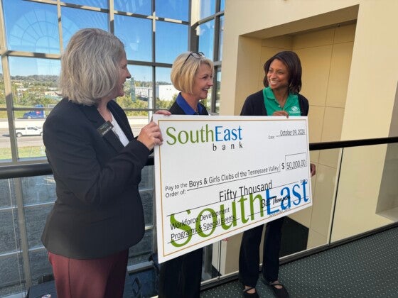 Representatives of SouthEast Bank and Boys & Girls Clubs of Tennessee Valley holding presentation check